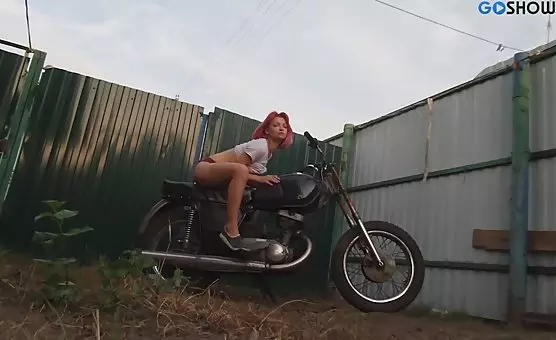 Teasing Babe Caresses Outdoor by Motorbike